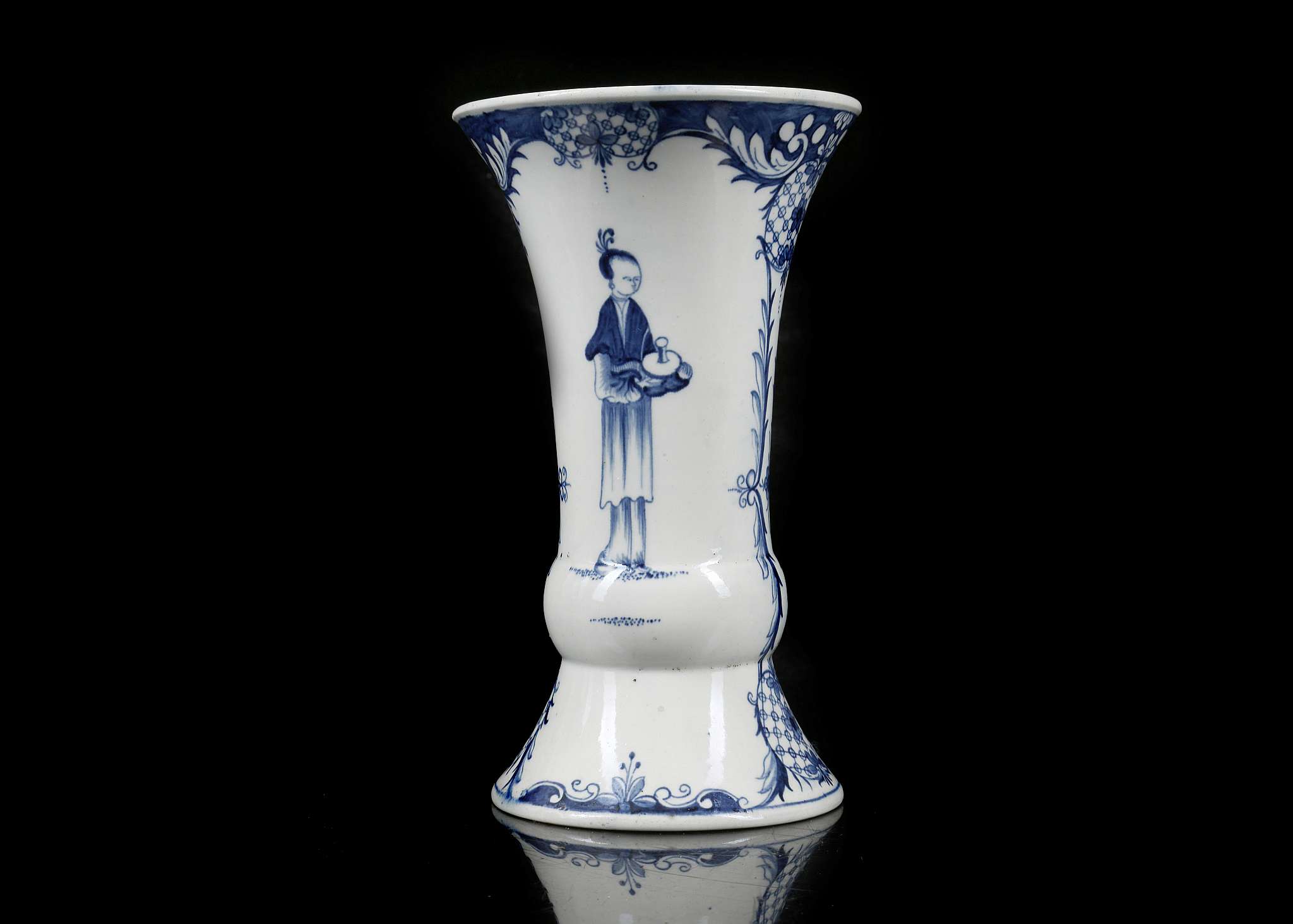 A WORCESTER PORCELAIN VASE, circa 1770, of waisted 'Gu' form, painted in blue with a variation of '