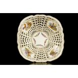 A BERLIN PORCELAIN RETICULATED ORNITHOLOGICAL BOWL OR BASKET, late 19th century, the pierced sides