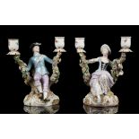 A PAIR OF MEISSEN PORCELAIN TWIN-BRANCH FIGURAL CANDLESTICKS, mid-19th century, after the