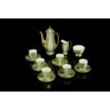 A ROYAL DOULTON PORCELAIN COFFEE SERVICE, early 20th century, of faceted octagonal form richly