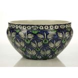 AN IZNIK-STYLE CANTAGALLI POTTERY BOWL, late 19th century, decorated in black and green with a