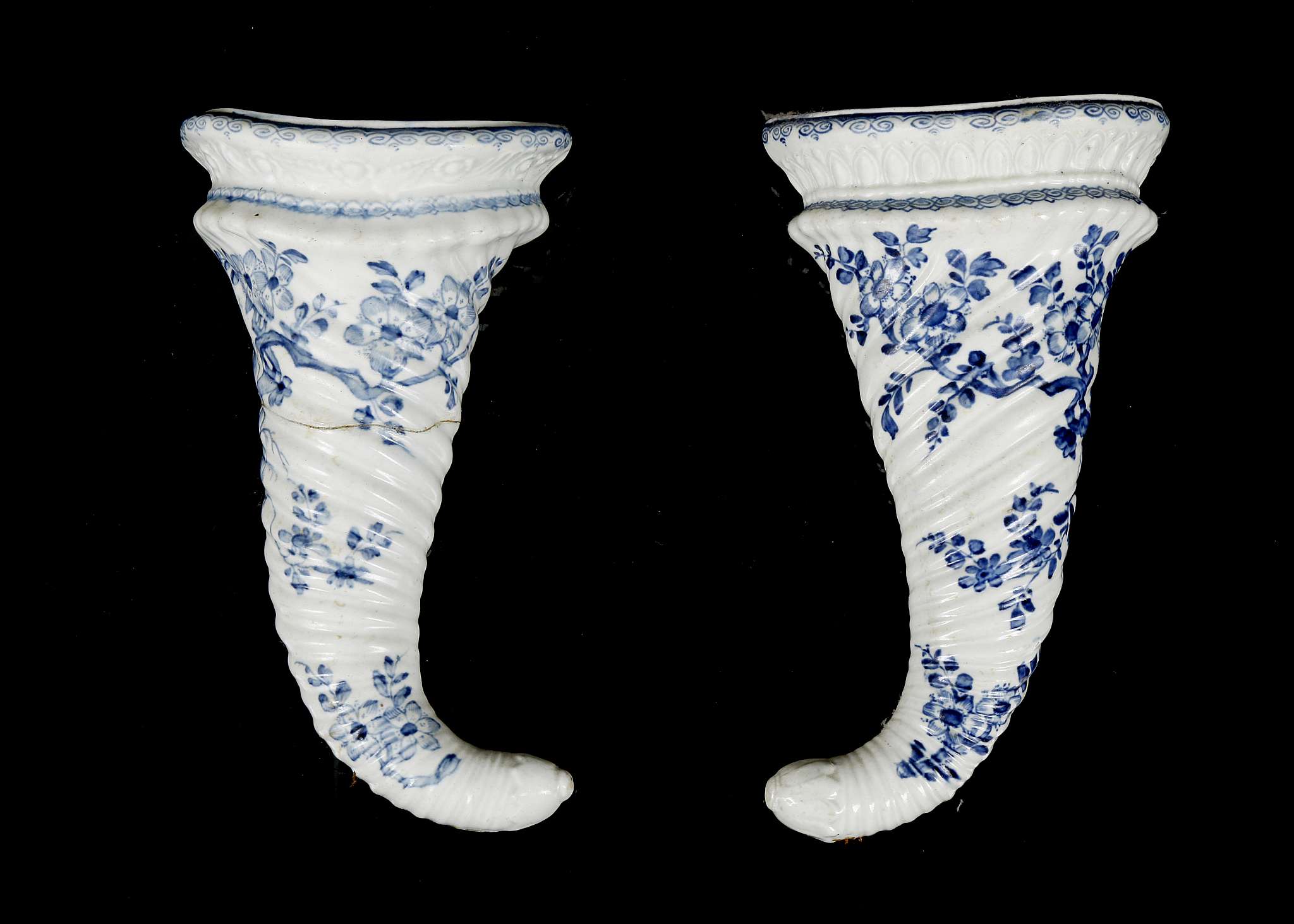 TWO WORCESTER PORCELAIN CORNUCOPIA WALL POCKETS, circa 1755-60, both of spirally moulded horn