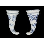 TWO WORCESTER PORCELAIN CORNUCOPIA WALL POCKETS, circa 1755-60, both of spirally moulded horn