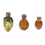 A COLLECTION OF THREE VICTORIAN / EDWARDIAN NOVELTY PORCELAIN SCENT BOTTLES MODELLED AS NUTS, each