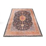 A SIGNED NORTH-EAST PERSIAN CARPET CIRCA 1930 approx: 10ft.9in. x 8ft.2in.(326cm. x 248cm.) The