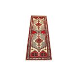 A FINE SERAB RUNNER NORTH-WEST PERSIA, CIRCA 1940 approx: 14ft.10in. x 3ft.11in.(452cm. x 119cm.)