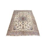 A SIGNED KIRMAN CARPET SOUTH PERSIA, CIRCA 1910 approx; 11ft.1in. x 8ft.3in.(337cm. x 251cm.) The