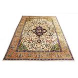 A TABRIZ CARPET NORTH-WEST PERSIA, CA 1920 approx: 12ft.5in. x 9ft.5in.(379cm. x 286cm.) Very good