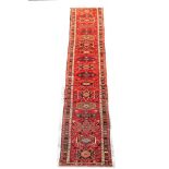 A VERY LONG KARAJA RUNNER NORTH-WEST PERSIA, CIRCA MID 20TH CENTURY approx: 29ft.10in. x 2ft.8in.(