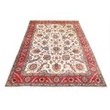 A SIGNED TABRIZ CARPET NORTH-WEST PERSIA, CIRCA 1930 approx: 12ft.5in. x 9ft.7in.(379cm. x 291cm.)