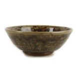 MIKE DODD STUDIO POTTERY BOWL, CIRCA 1968, with incised decoration and green glaze, (23cm diam.).