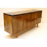 A 1950s ROSEWOOD ALBEMARLE SIDEBOARD, designed by Robin Day, manufactured by Hille, with black