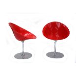 A PAIR OF EROS CHAIRS, DESIGNED BY PHILIPPE STARCK, MANUFACTURED BY KARTELL, red polycarbonate seats