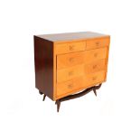 A 1950s CHEST OF DRAWERS, DESIGNED BY JOSE BERENFELD, in contrasting light and dark wood, with