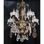 A MID 20th CENTURY FRENCH CHANDELIER, with clear and peach glass drops (50cm diameter x 65cm high).