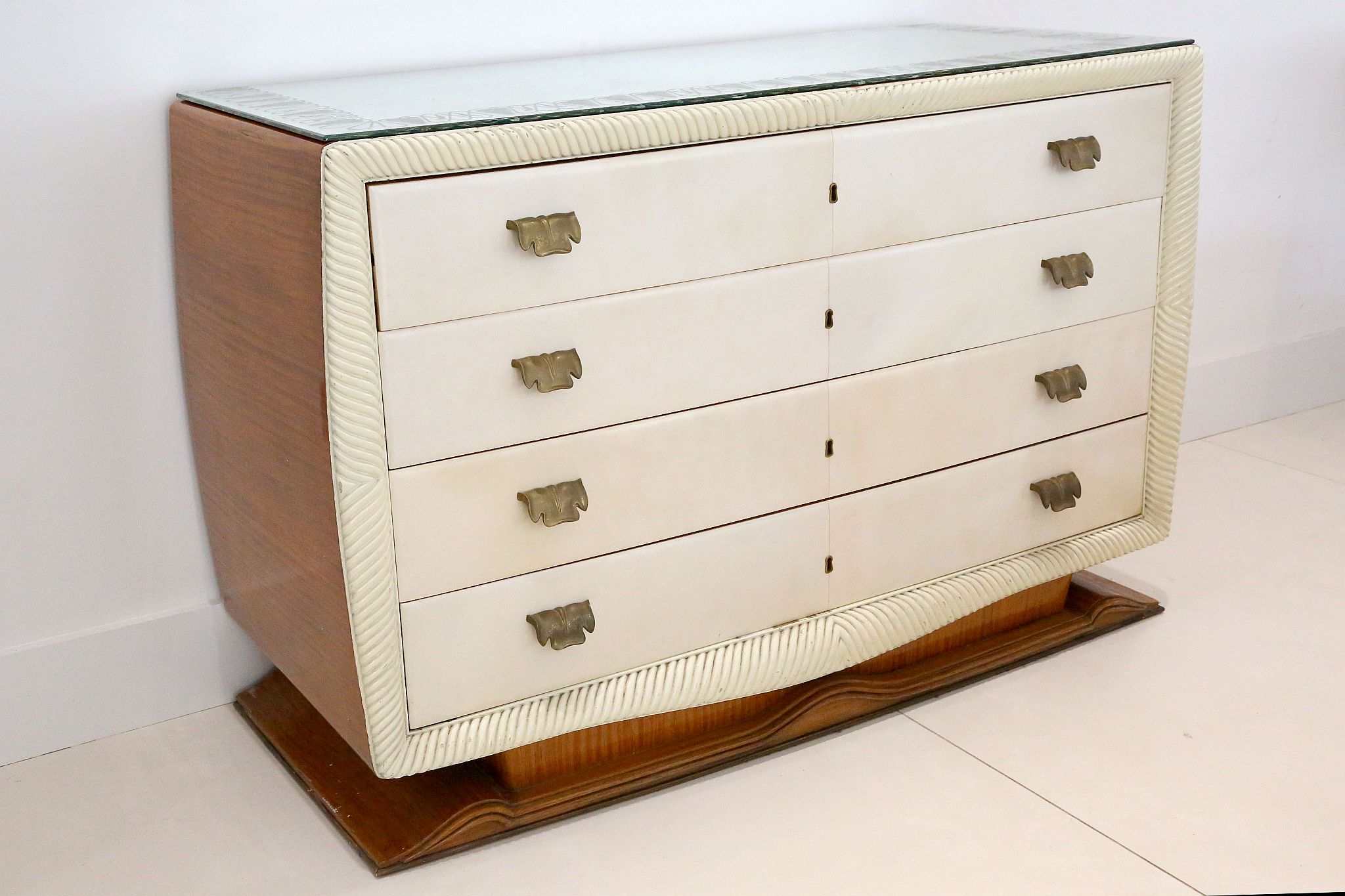 A 1950s ITALIAN PARCHMENT FRONT CHEST OF DRAWERS, with mirrored top, four drawers with lacquered