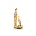 A CHINESE IVORY ‘LADY AND BIRD’ CARVING. Qing Dynasty. Standing beside the bird its right claw