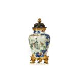 A CHINESE WUCAI 'LADIES' JAR WITH ORMOLU MOUNTS. Transitional era. The broad-shouldered jar is