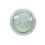 A LARGE CHINESE LONGQUAN CELADON CHARGER. Ming Dynasty. A central roundel incised with floral