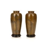 A PAIR OF SENTOKU VASES WITH STANDS. Meiji period. Elegantly decorated with bamboo and flowering