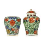 TWO CHINESE WUCAI JARS. Transitional era. Each decorated with chrysanthemum heads borne on densely