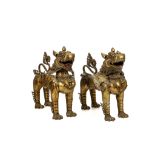 A PAIR OF BRONZE TEMPLE GUARDIANS. Early 20th Century.. 47cm H. Provenance: From Avening Court,