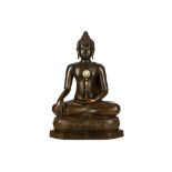 A THAI SEATED BRONZE BUDDHA. Thailand, 19th / 20th Century. Seated in vajrasana on a shaped base,