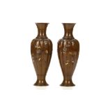 AN ATTRACTIVE PAIR OF INLAID BRONZE VASES. Meiji period. Each of slender ribbed body with everted