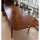 A 1960s RECTANGULAR EXTENDING DINING TABLE, manufactured by Archie Shine, (Table: 144.5 x 83.5 x