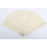 19th century Canton carved ivory fan the pierced sticks decorated with a continuous figurative