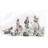A collection of Lladro porcelain figures to include a dog in boat,duck with ducklings, girl