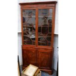 George III mahogany 2 part standing corner cabinet the upper section enclosed by 2 astragal glazed