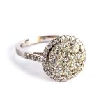 A diamond dress ring, The cluster of brilliant-cut diamonds, the largest to the centre, within a