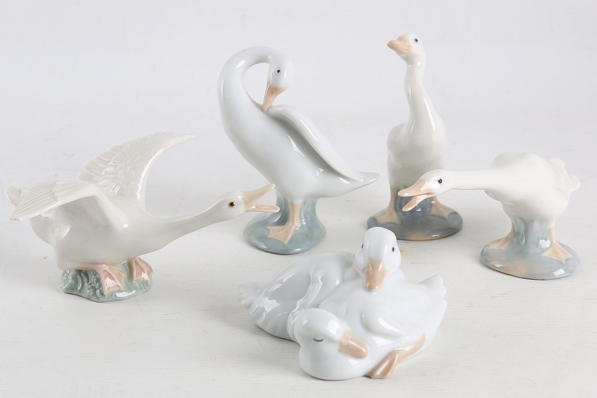 A collection of Lladro porcelain, to include four figures of ducks, and five figures of girls, one - Image 2 of 4