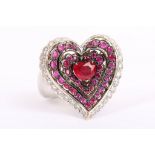 NOURBEL. An 18k white gold and ruby set heart cluster dress ring. Size: M.