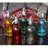 Set of 6 coloured glass decanter bottles modeled as vintage soda siphons.