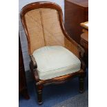 William IV Bergere library chair with caned back, later solid seat,acanthus capped scroll arms and