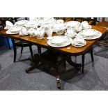 A 19th Century mahogany cross banded dining table, on quadrant pedestal with gilt adornments, 138