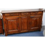 A 19th century French oak sideboard having 3 apron drawers over 2 shaped panel drawers either side
