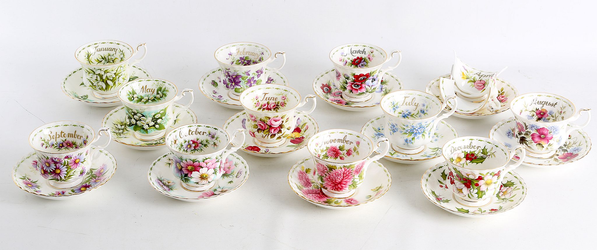 AMENDED - A twelve piece Royal Albert tea cups and saucers from the "Flowers of the Month" series