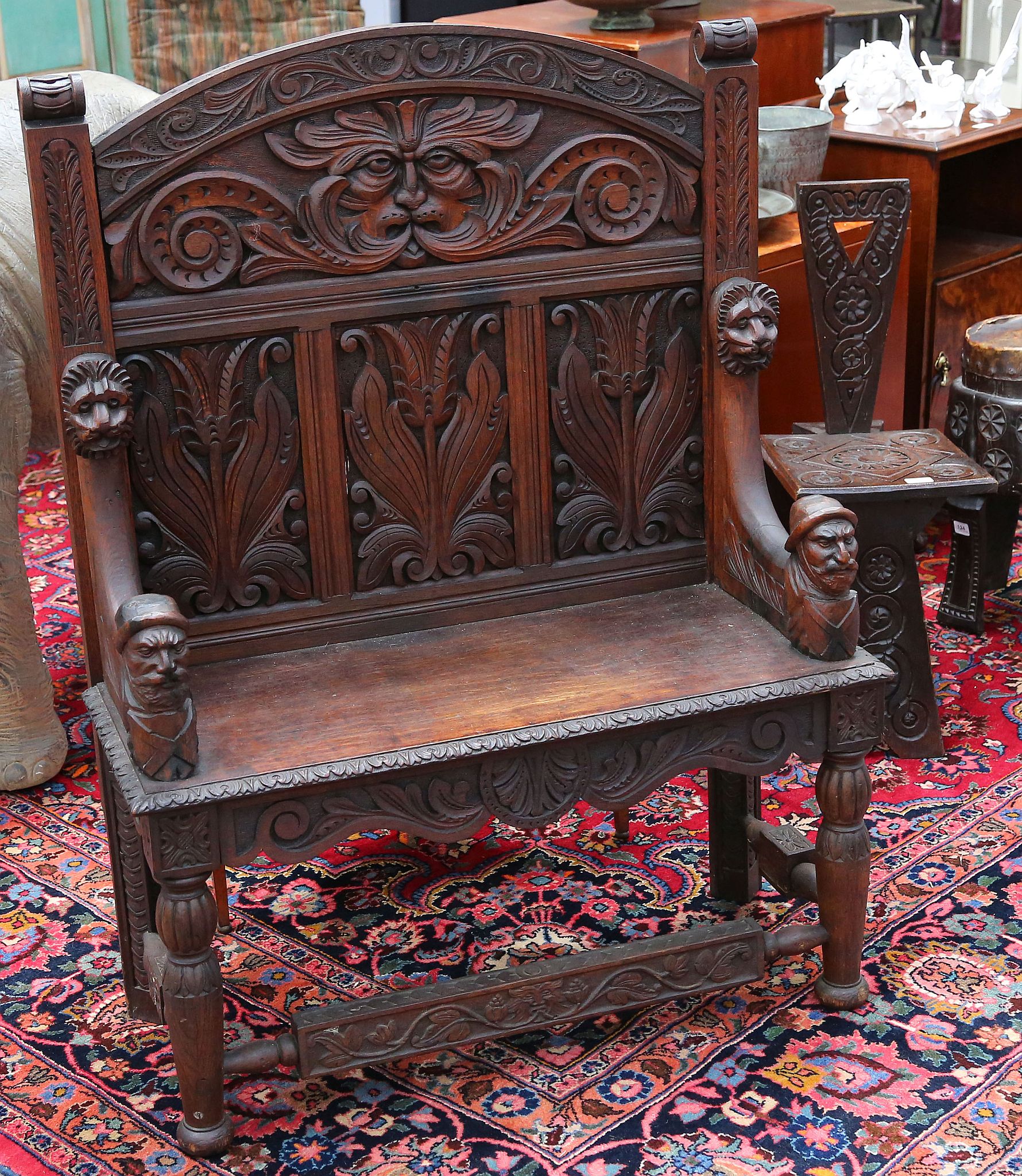 Late 19th / early 20th century Flemish panelled oak high back bench seat carved throughout with