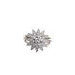 A diamond star dress ring  Of tiered design, set throughout with brilliant-cut diamonds, the largest