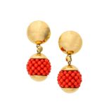 A pair of coral earrings and a ring Each earring set with small coral corallium rubrum beads forming
