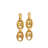 A pair of pendent earclips, by Weingrill Each designed as a line of slightly tapered anchor-links,