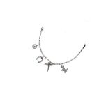 A gem-set and diamond charm bracelet, by Tiffany & Co. The paper-link chain, suspending four charms,