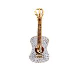 A diamond-set guitar brooch  The soundboard pavé-set with brilliant-cut diamonds, the fingerboard
