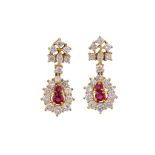A pair of ruby and diamond earrings Each designed