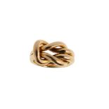 A dress ring, by Cartier Designed as a square knot, to a double polished band, signed Cartier,