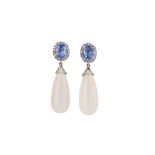 A pair of sapphire and moonstone pendent earrings Each oval-cut sapphire, within a surround of