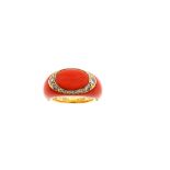 A coral and diamond dress ring Designed as an oval cabochon coral corallium rubrum, rimmed by a band